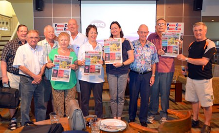 Several PCEC members hold up the current issue of Pattaya Mail as they congratulate Peter Malhotra and the Pattaya Mail staff on their upcoming 21st anniversary.