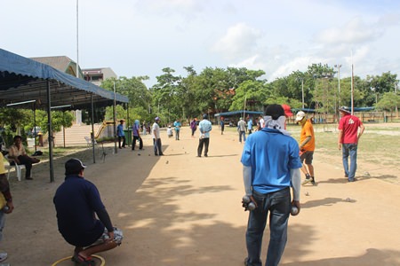 Petanque players test their skills at the 13th Pattaya Petanque tournament held at the Pattaya No. 2 School, June 21.