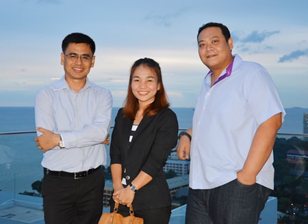 From Cape Dara Resort, Sittidej Rochanavibhata, the General Manager, Nipaporn Phesatcha, Executive Catering, and Tanin Suphavittayakorn, the Executive Assistant Manager pose for a photo on the rooftop of the Executive Tower, Holiday Inn Pattaya.