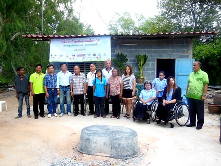 Sponsors gather for a group photo with the family.