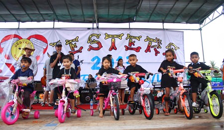 The Fountain of Life ‘best of class’ children receive their bicycles during last year’s event.