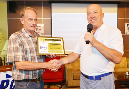 PCEC Chairman Roy Albiston (right) gives a certificate of appreciation to member Stuart Saunders (left) in recognition for his six years as the Club’s Vice Chairman. Stuart stepped down from the Board of Governors this year because of other commitments.