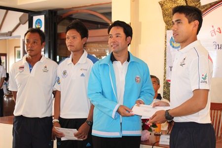 Pattaya Mayor Itthiphol Kunplome (2nd right) presents a sponsorship award to Aek Bunswad (right).  The young Thai windsurfer is currently competing at the Asian Games in Incheon.