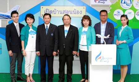 (2nd left to right) M.L. Nandhika Voravarn - Bangkok Airways Vice President, Corporate Communications; Anupharp Thirarath - Deputy Governor for Domestic Marketing, Tourism Authority of Thailand; Puttipong Prasarttong-Osoth, President of Bangkok Airways, Ariya Prasarttong-Osoth - Vice President, Sales, Bangkok Airways; and Thanawat Thongperm, Representative Professor.