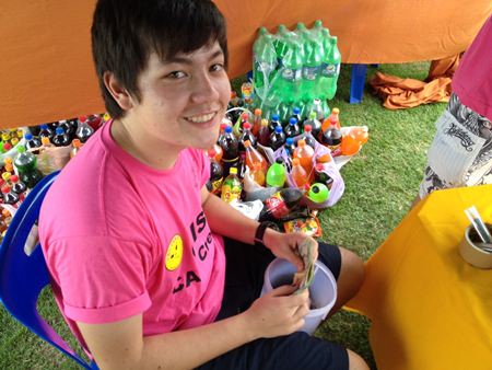 An IB student counts the cash - GIS raised 12,000 baht for charity.