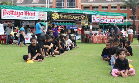Children wait in line to participate in the tug-o-war competition.
