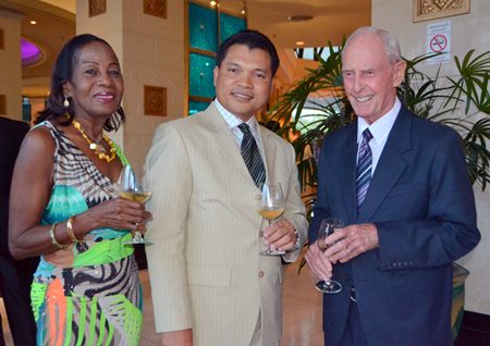Natthachai Chaiprom (center) poses for a photo with Richard Smith and his wife Janet.
