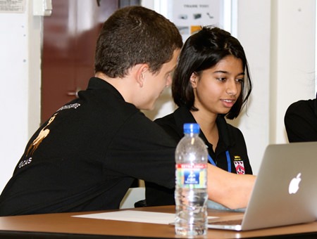 Top students Thomas Savage and Surabhi Vanalia preparing for a debate.