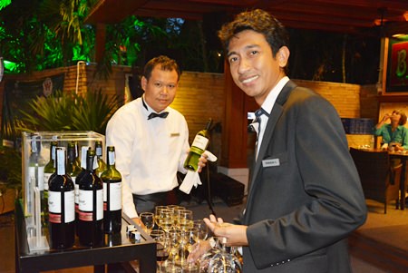 One of the staff asks, “Would you like a glass of red or white sir?”