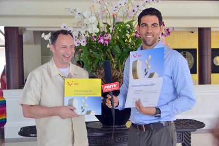 Hotel Manager Danilo Becker (right) receives the award on behalf of the hotel from Peter Abi-Saleh.