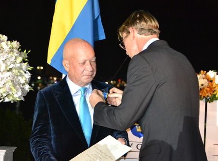 His Excellency Klas Molin bestows the Order of the Polar Star on Dr Sunya.