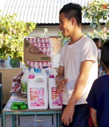 Giving out hygiene supplies to the students at Hway Ka Loke Boarding House.