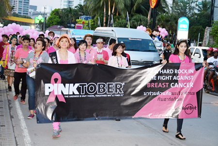 Pink-clad health workers from Bangkok Hospital Pattaya and about 100 hotel staffers march down Walking Street, helping to educate tourists and residents about breast cancer.