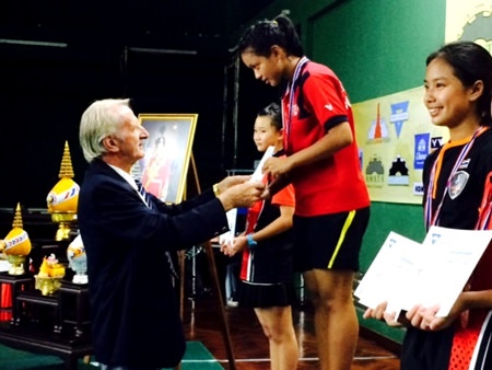 William Macey, Charity Chairman of the PSC, presents medals to the under-16 girls winners.