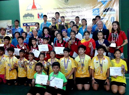 Young champions and medal winners pose for a group photo.