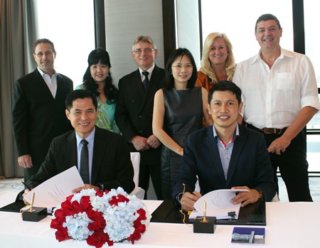 Stephen Ho, President of Starwood Hotels & Resorts Asia Pacific (front left), and Sawit Ketroj, Managing Director of Phuket Advance Development Ltd (front right) pose with Starwood senior regional management during the contract signing ceremony for the development of the Sheraton Phuket Kalim Beach Resort.  Lothar Pehl, Starwood Senior Vice President of Operations and Global Initiatives and Regional Vice President, Hotels & Resorts, Thailand, Cambodia and Vietnam, stands 3rd from left.