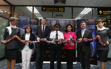 (Left to right) Anoma Vongyai, Tourism Authority of Thailand Director - Phuket Office; Craig Thomas, Etihad Airways Vice President Asia Pacific North and Indian Sub-Continent; Captain Adel Al Zubaidi; Monruedee Ketphan, Director of Phuket International Airport; Dimitrios Karagkioules, Etihad Airways new General Manager for Thailand; and Etihad Airways cabin crew celebrate the airline’s inaugural Phuket to Abu Dhabi flight with a floral garland cutting ceremony at Phuket International Airport.