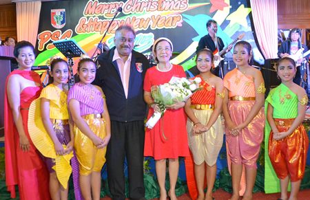Noi, Peter and Khun Toy pose with the exquisite dancers from the Pattaya Orphanage.