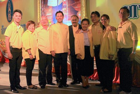 Local dignitaries pose for a group photo after the closing ceremony.