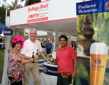 Elfi Seitz, Brendan Daly and Tony Malhotra seen enjoying Paulaner beer at the Pattaya Mail booth.