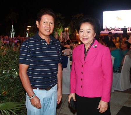 Panga Vathanakul (right), managing director of the Royal Cliff Hotels Group and Santi Bhirombhakdi (left), president of Singha Corporation Co., Ltd., attend the 12th Roi Duang Jai Sai Yai Singha dinner poolside at the Royal Cliff Beach Hotel.