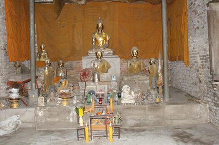 Buddha statues and other artifacts remain inside the ancient temple.