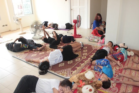 Children try out one of the unfinished new spacious bedrooms at the Baan Jing Jai Home.