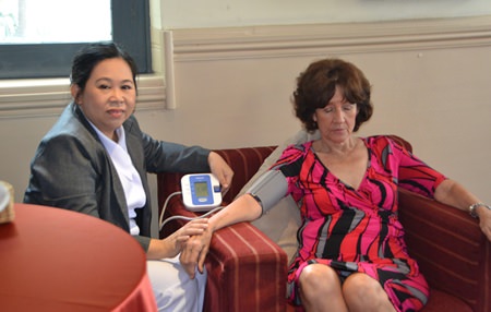 PCEC members and guests take advantage of free blood pressure checks offered by Phyathai Hospital.