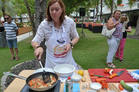 PILC President Helle Rantsen expertly prepares her fried rice dish.