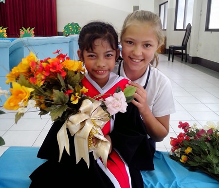 On her first Temple 2 Temple challenge in October 2013, when she cycled 459km from Ayutthaya to Angkor Wat in Cambodia, Poppy (right) raised B250,000 for a young deaf girl (left) at the Sotpattana School for the Deaf.