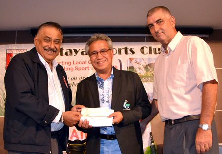 PSC President Peter Malhotra (left) presents a cheque for 100,000 baht to Mike, President of the EGA (centre) for the EGA Caddy Championship 2015 as Golf Chairman Mark West (right) looks on.