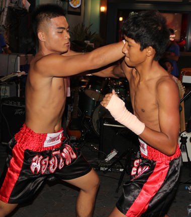 The Muay Thai exhibition was staged, but the fighters were cheered by the crowd.