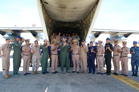 U.S. Air Force Brig. Gen. Michael Minihan (center left) and Royal Thai Navy Rear Adm. Graisrl Gesom (center right) visit the site of the pallet load and thank everyone involved with the mission.