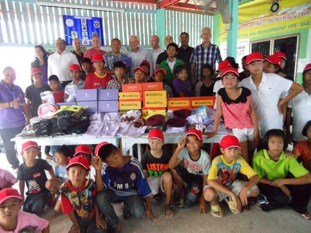 Members of the Foreign Anti-Narcotics Community Thailand donate school uniforms and other supplies to the Anti-Human Trafficking and Child Abuse Center.