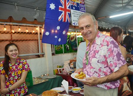 Dick Caggiano, who has been here longer than even Foodland, takes some time to sample a few of the dishes being served.