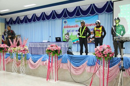 Sattahip traffic police sub-inspector, Pol. Capt. Wiroj Charitrum (left) and officers from the Sattahip traffic police, teach students about traffic law.