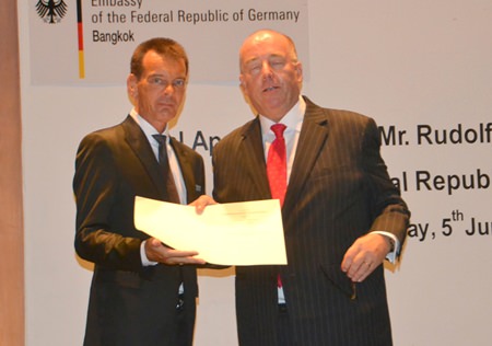 German Ambassador H.E. Rolf Schulze gives Rudolf Hofer his credentials.