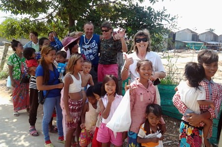 Gerry with Jolanda & Esther hand out toothbrushes and toothpaste to families from the construction camps.