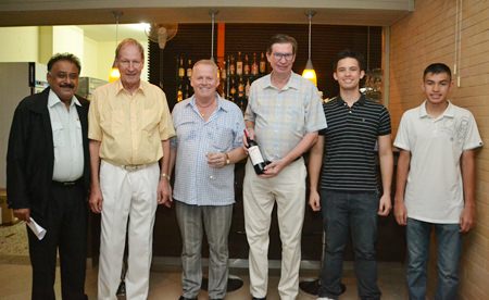 (L to R) Peter Malhotra, managing director of the Pattaya Mail Media Group, Helmut Zimmermann, general manager of the VN Garden Restaurant, Gudmund Eiksund, managing director of the Norwegian Properties Group, take a break from the fun to pose for a group photo with the men of the Aamlid family, Jan, Kevin and Matthew.