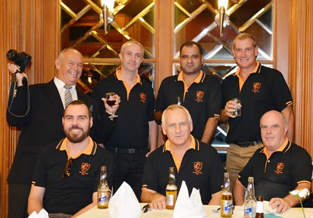 Rodney Charman (standing left) cheers on the Pattaya Cricket Club team led by Captain Simon Philbrook (standing right).