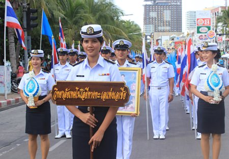 Students from Asia Technology University look smart as they march in their dress whites for the Mother’s Day parade.