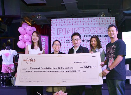 (From left) Anusara Kithisook, PR manager of the Thanyarak Breast Cancer Foundation, Yuwathida Jeerapat, Pattaya City Councilor Region 2, and Rattanachai Sutidechanai, vice chairman of the Pattaya City Council, along with Hard Rock staff, display a cheque for over 92,000 baht raised by selling pink products, food, beverages and accommodations since October last year, which has been donated to the Thanyarak Breast Cancer Foundation.