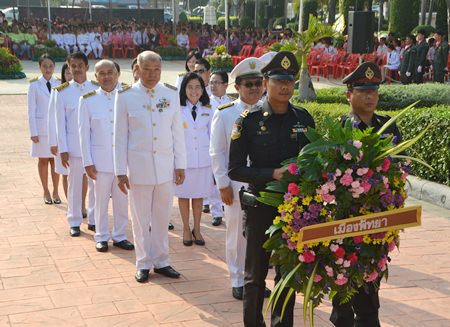 Local government officials, police, military and private citizens pay their respects to King Rama V on Chulalongkorn Day.