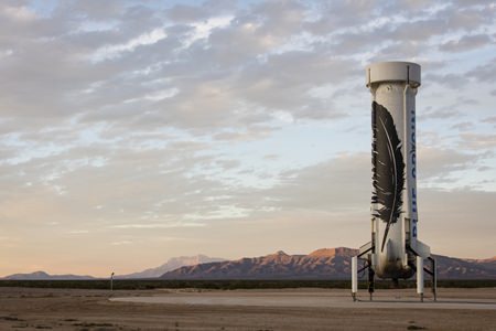 In this photo provided by Blue Origin taken on Monday, Nov. 23, 2015, an unmanned Blue Origin booster rocket sits after landing in Van Horn, West Texas. (Blue Origin via AP)
