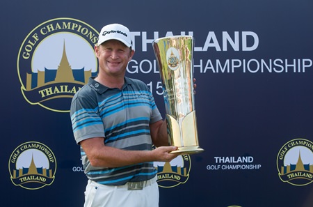 Jamie Donaldson of Wales holds up the trophy after winning the 2015 Thailand Golf Championship at Amata Spring Country Club in Chonburi, Sunday, December 13.