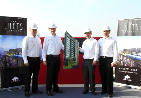 (From left to right) Raimon Land executives Clifford Chan, Manager – Project Commercial; Gerard Healy, Vice President – Development; Sataporn Amornvorapak, Director & Chief Financial Officer; and Chaipat Taechapornwiwat, Deputy Vice President – Construction, pose for a photo during the topping-off ceremony for The Lofts Ekkamai in Bangkok on February 5.