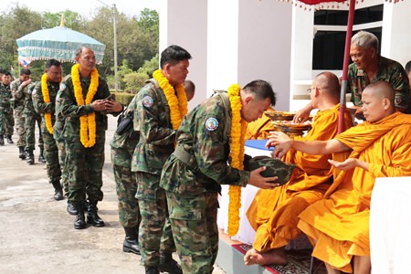 Buddhist monks bless the soldiers before they embark on their mission.