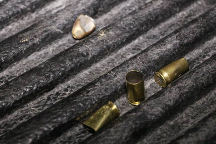 A recovered bullet and spent casings found at the scene.