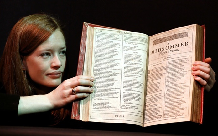 A Christie’s member of staff displays an unrecorded copy of the First Folio, the first collected edition of Shakespeare’s plays, widely considered the most important literary publication in the English language. (AP Photo/Kirsty Wigglesworth)