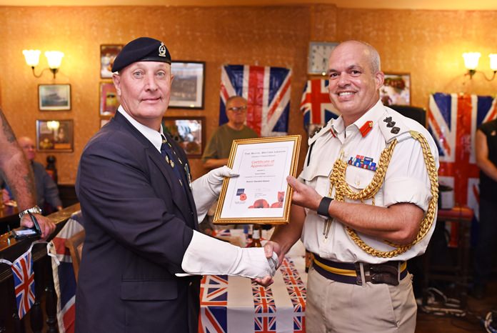 RBL Standard Bearer Richard Holmes receives a certificate of appreciation from Colonel Chris Luckham, Assistant Defence Attaché.